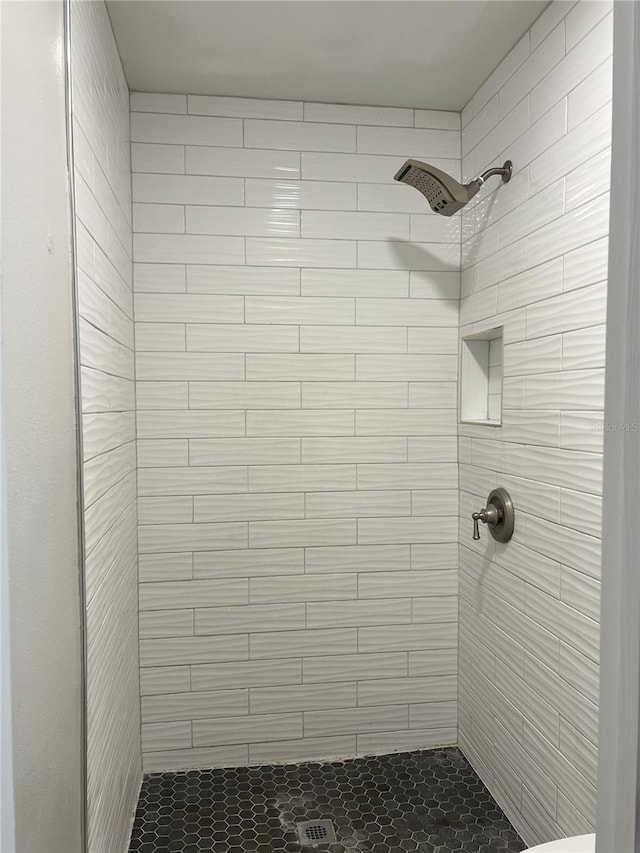 full bath featuring a shower stall