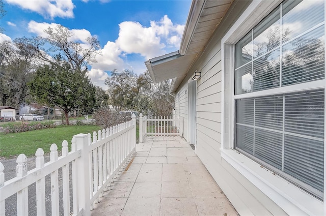 view of patio featuring fence