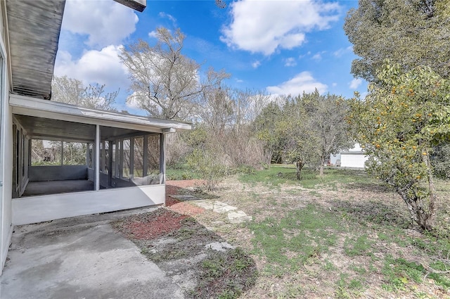 view of yard featuring a sunroom