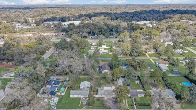 birds eye view of property with a residential view and a view of trees