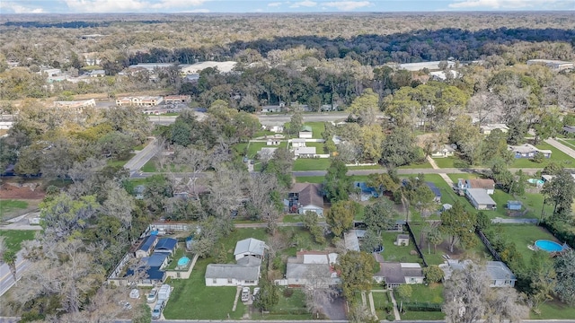 aerial view featuring a forest view and a residential view