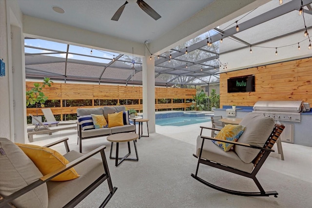 view of patio featuring glass enclosure, exterior kitchen, a pool with connected hot tub, and an outdoor living space