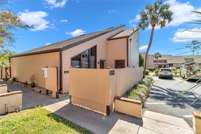 view of property exterior featuring a fenced front yard