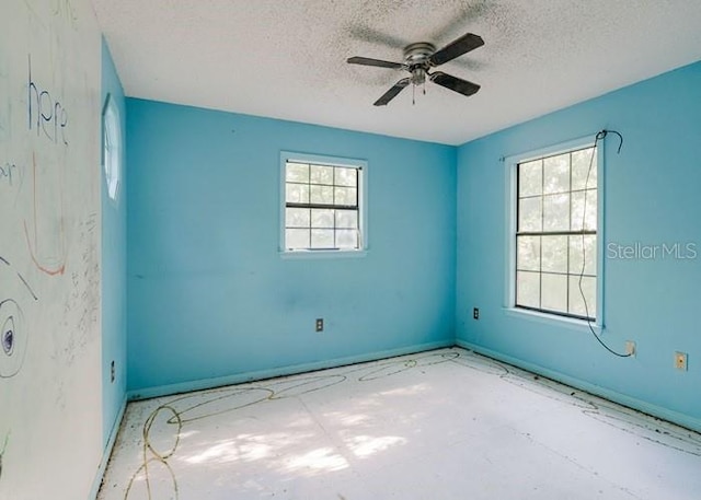 106 Thurston Pl, Crestview, FL 32536 - unfurnished room with a textured ceiling, a ceiling fan, and baseboards