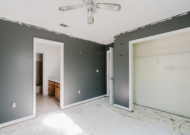 106 Thurston Pl, Crestview, FL 32536 - unfurnished bedroom featuring a closet, baseboards, connected bathroom, and ceiling fan