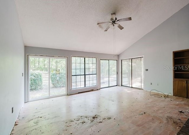 106 Thurston Pl, Crestview, FL 32536 - unfurnished living room with ceiling fan, high vaulted ceiling, and a textured ceiling