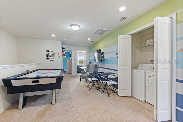 rec room featuring recessed lighting, visible vents, light carpet, and separate washer and dryer