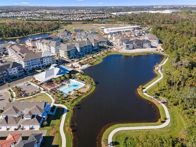 birds eye view of property with a water view and a residential view