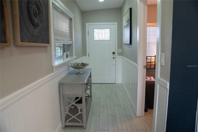 interior space featuring wainscoting and light wood-style flooring