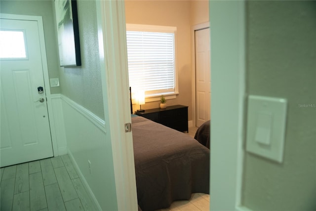 interior space featuring wainscoting and light wood finished floors