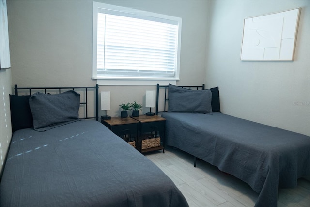 bedroom with wood finished floors