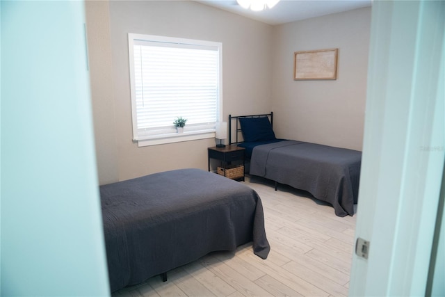 bedroom featuring light wood finished floors