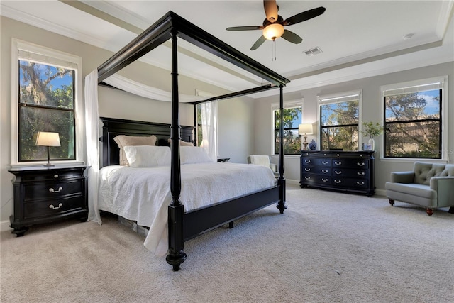 bedroom featuring ornamental molding, multiple windows, carpet, and visible vents