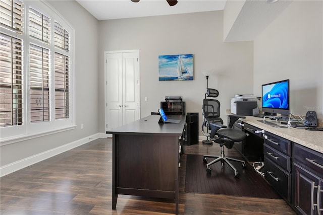 office featuring dark wood-style floors, baseboards, and a ceiling fan