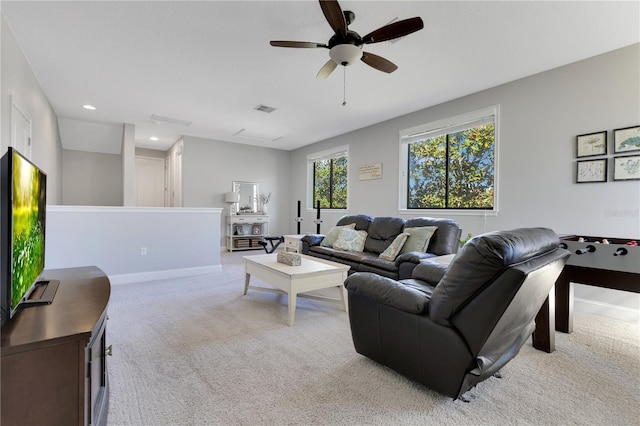 carpeted living room featuring a ceiling fan, recessed lighting, visible vents, and baseboards