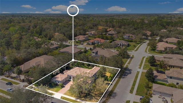 bird's eye view with a forest view and a residential view