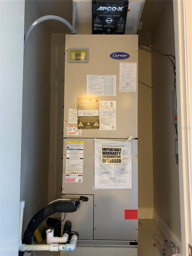 utility room with heating unit