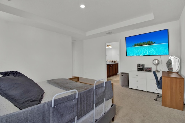 bedroom with recessed lighting, a raised ceiling, visible vents, and light colored carpet