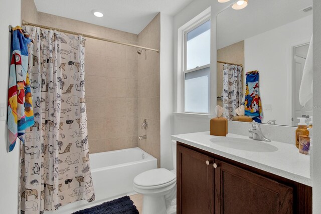 bathroom with toilet, visible vents, shower / bath combo with shower curtain, and vanity