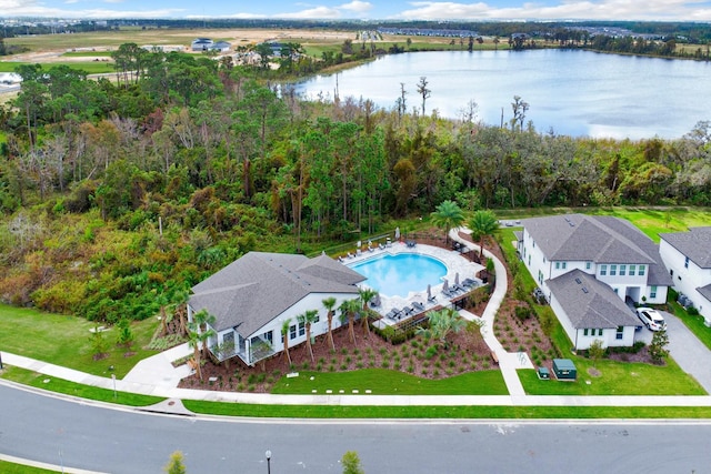 birds eye view of property with a water view