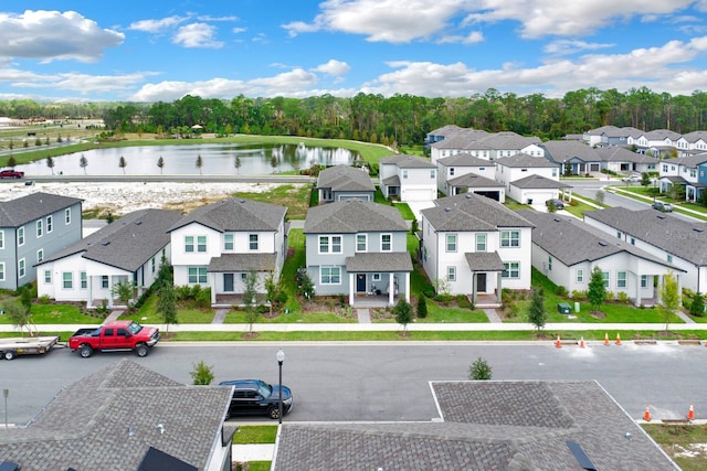 bird's eye view featuring a water view and a residential view