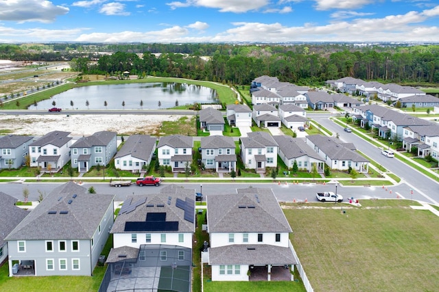 birds eye view of property with a residential view and a water view