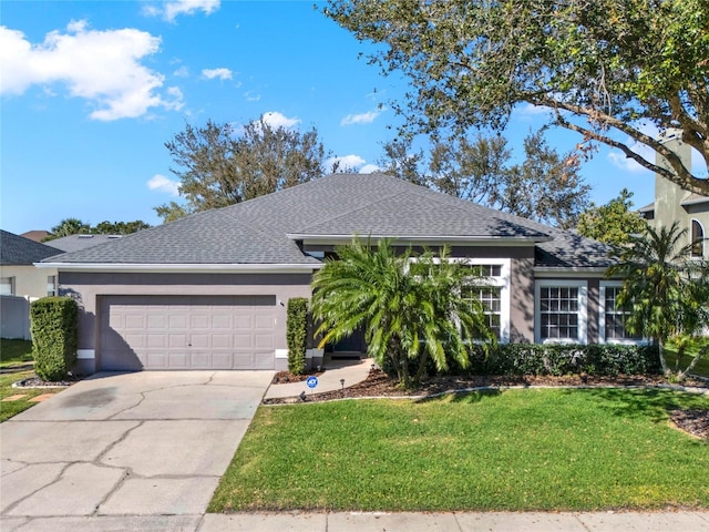 ranch-style house with concrete driveway, roof with shingles, an attached garage, a front lawn, and stucco siding