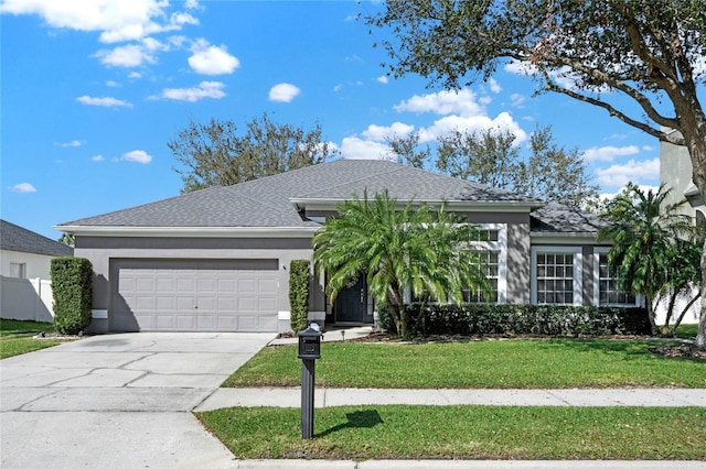 ranch-style house with a garage, a front yard, concrete driveway, and stucco siding