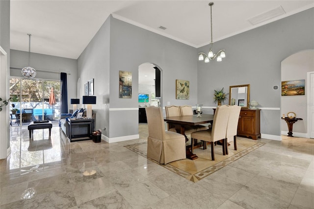 dining room featuring baseboards, visible vents, arched walkways, marble finish floor, and a chandelier