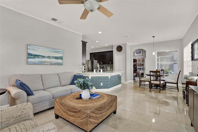 living area with baseboards, visible vents, ornamental molding, marble finish floor, and recessed lighting