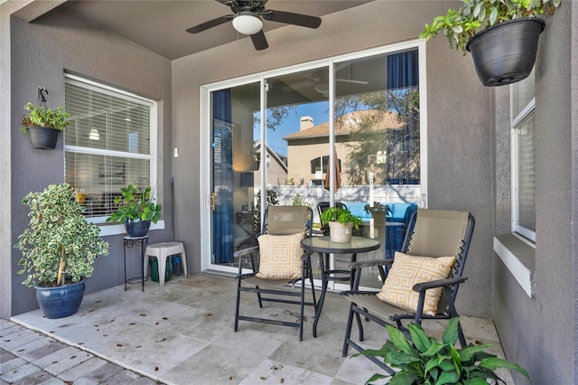 view of patio featuring a ceiling fan