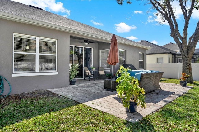 back of house featuring stucco siding, an outdoor hangout area, a patio area, ceiling fan, and fence