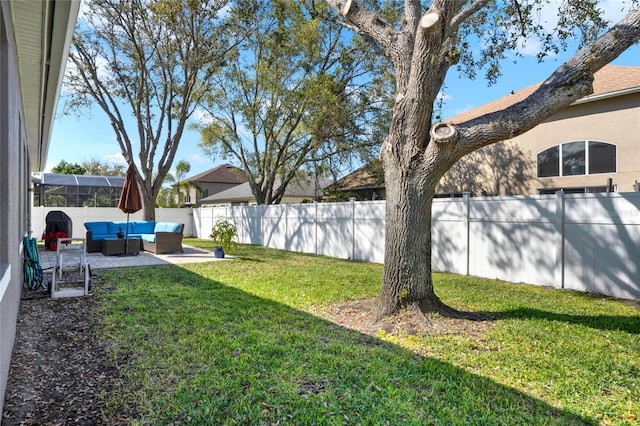 view of yard with a fenced backyard, outdoor lounge area, and a patio