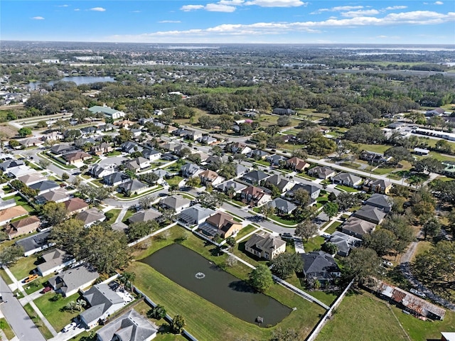 birds eye view of property with a residential view and a water view