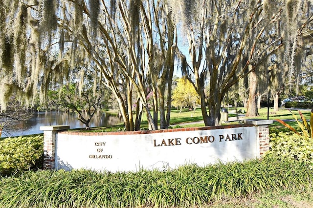 community sign with a water view