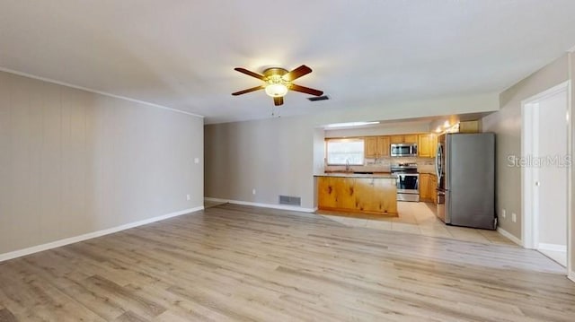 unfurnished living room featuring a ceiling fan, baseboards, visible vents, and light wood finished floors