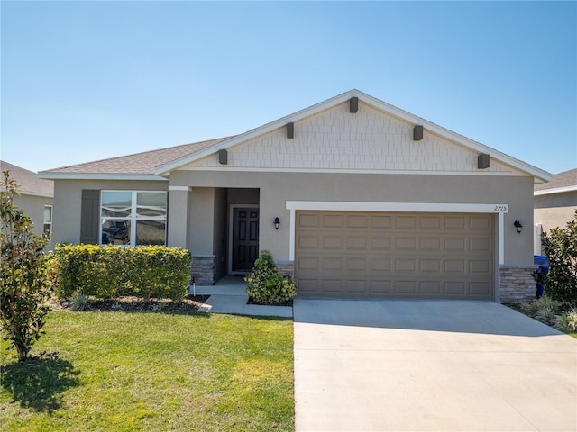 craftsman-style house with a garage, stone siding, concrete driveway, stucco siding, and a front lawn