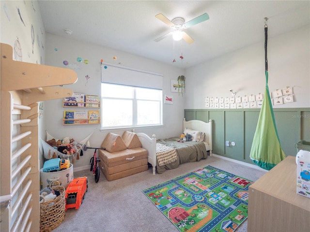 bedroom with a ceiling fan and carpet flooring