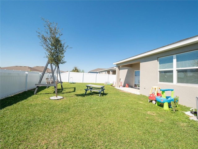 view of yard with a fenced backyard