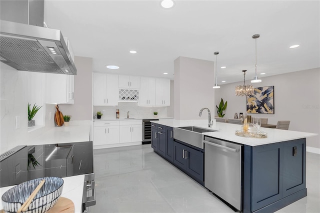 kitchen featuring ventilation hood, a sink, white cabinetry, stainless steel dishwasher, and beverage cooler