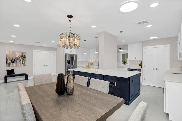 dining area with an inviting chandelier, recessed lighting, and visible vents