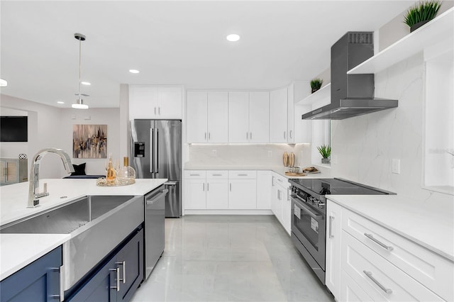 kitchen featuring white cabinetry, wall chimney range hood, open shelves, and appliances with stainless steel finishes