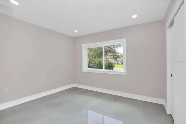 unfurnished bedroom with a closet, baseboards, and recessed lighting