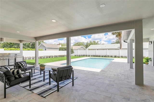 view of pool with a fenced backyard, an outdoor living space, a fenced in pool, area for grilling, and a patio area