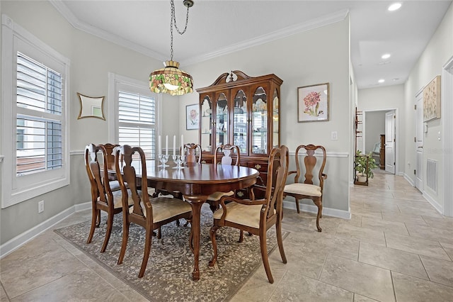 dining space featuring crown molding, recessed lighting, and baseboards