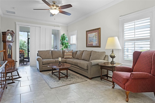 living room featuring visible vents, crown molding, and ceiling fan