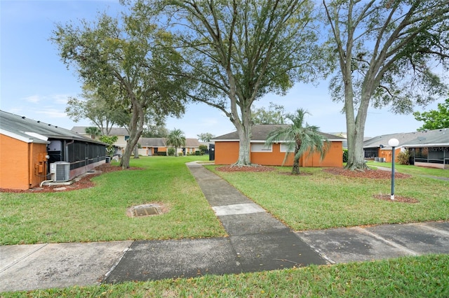 view of yard with central AC unit