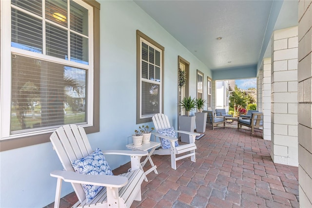 view of patio featuring a porch