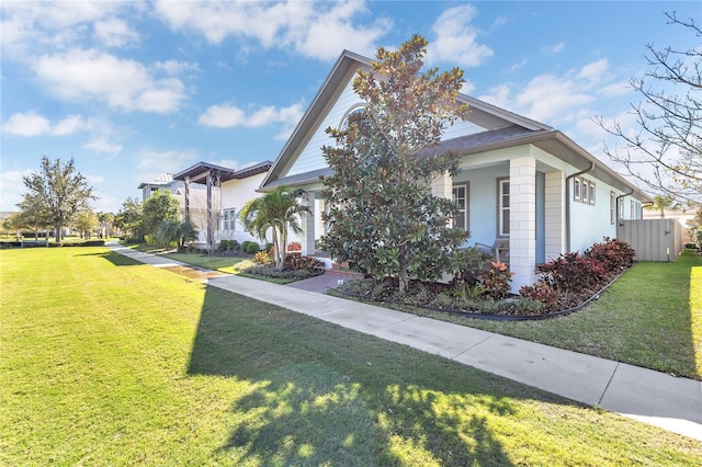 view of home's exterior with a lawn