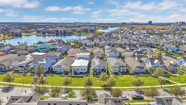 aerial view with a water view and a residential view